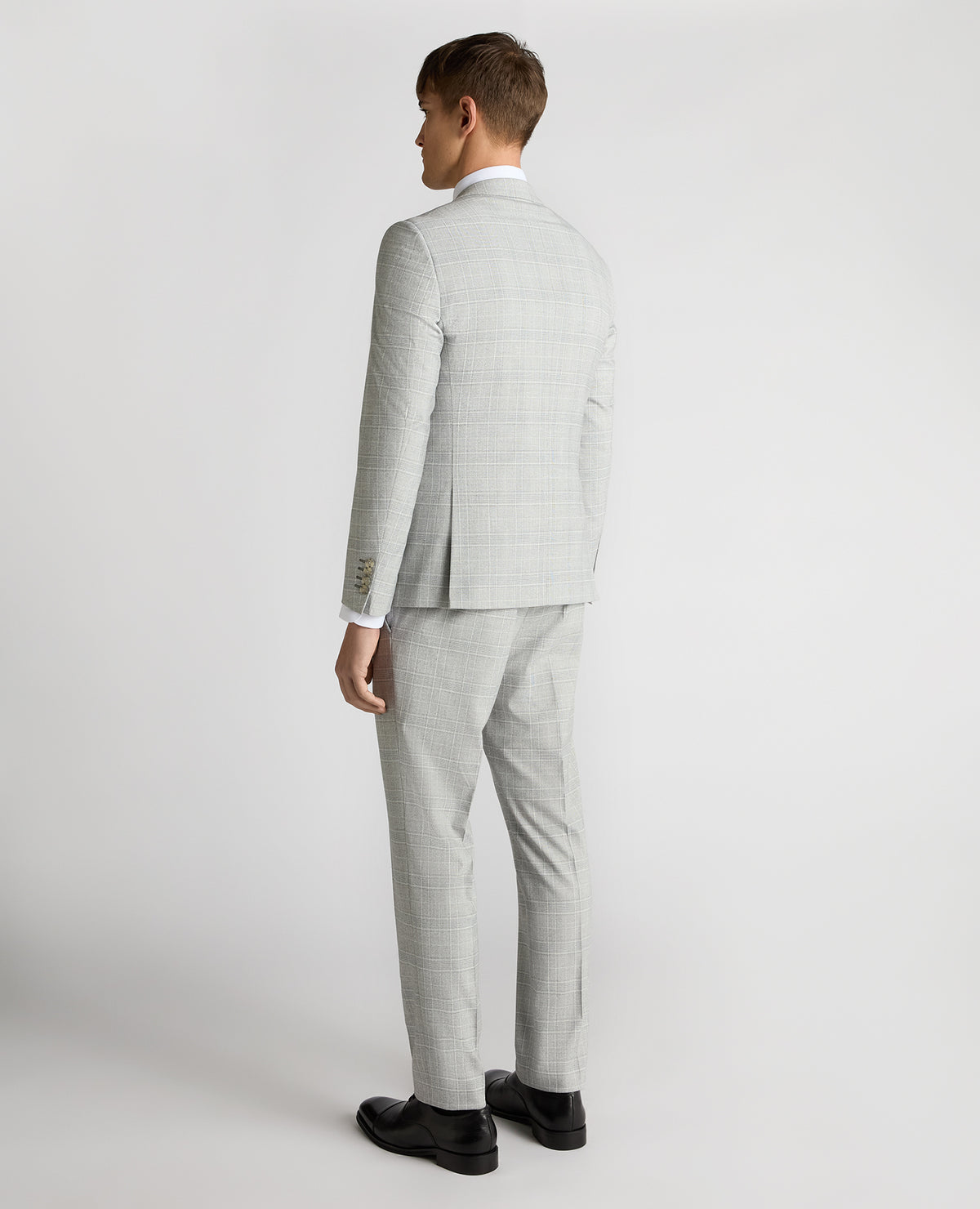 Man wearing a grey Slim Fit Checked Stretch Suit Jacket