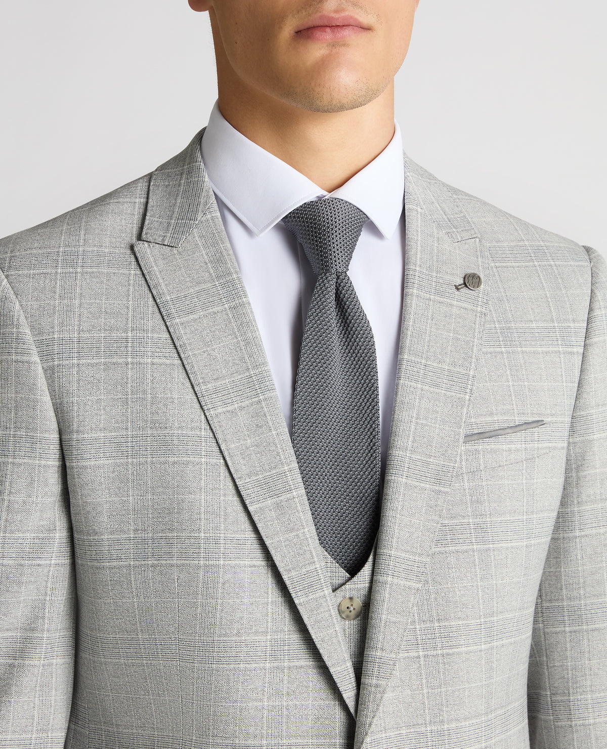 Man wearing a grey Slim Fit Checked Stretch Suit Jacket