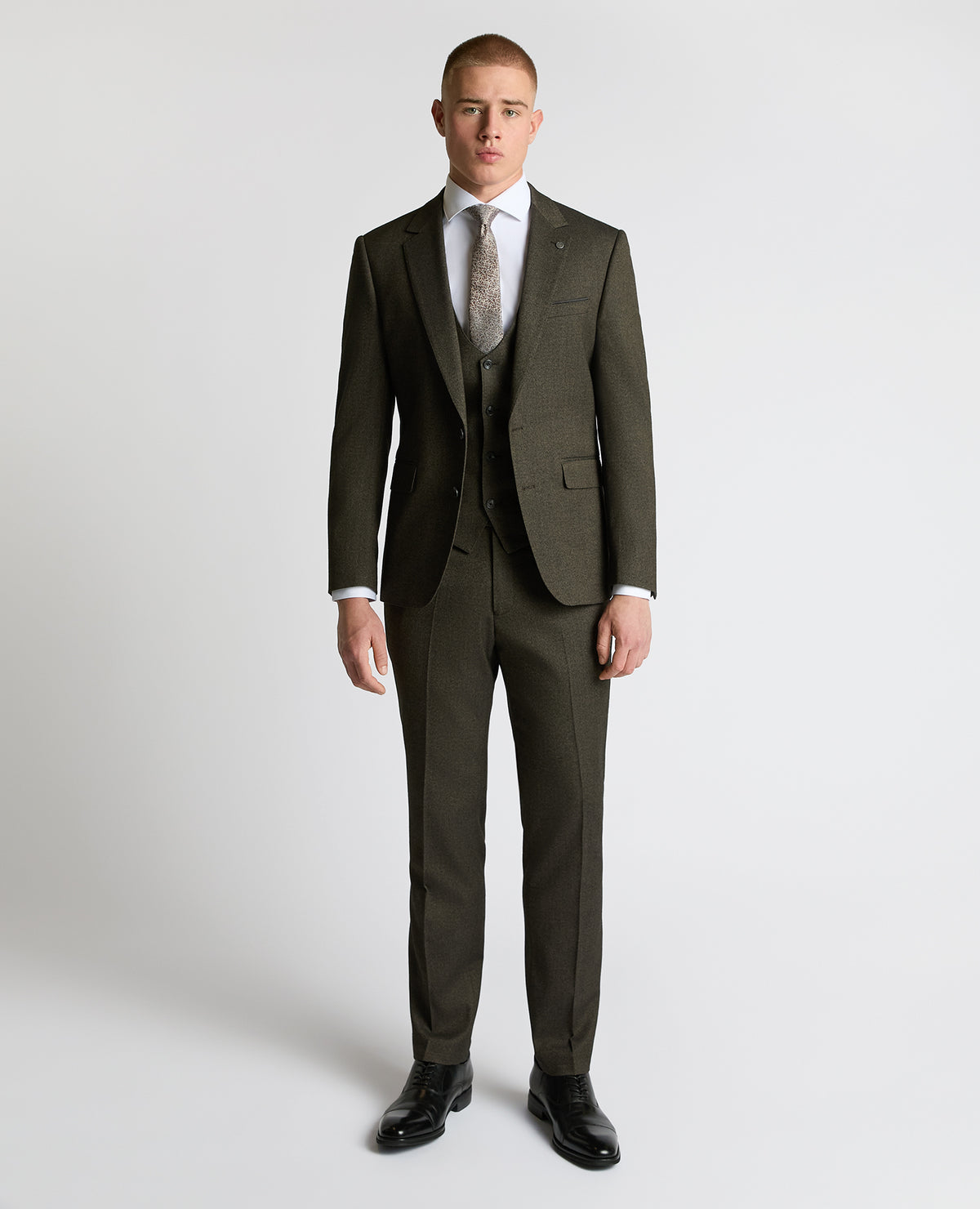Man wearing a brown Slim fit Stretch Suit Jacket