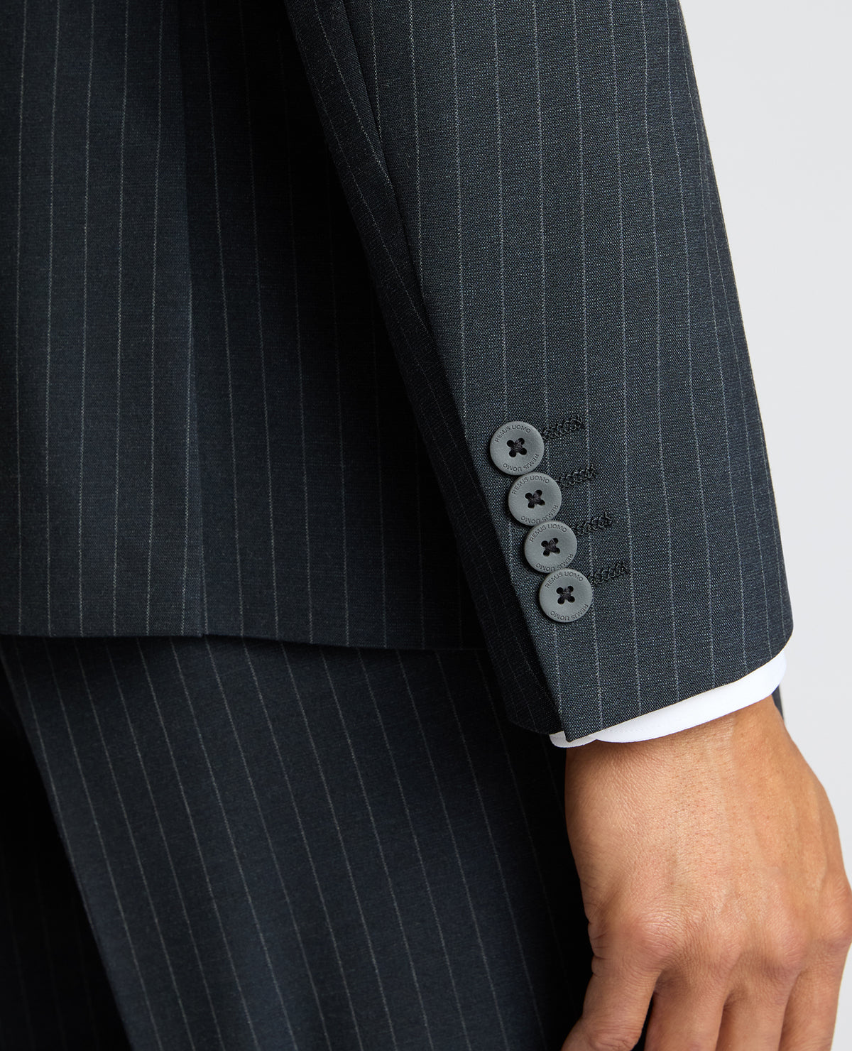 Man wearing a navy Slim Fit Stripe Stretch Jacket