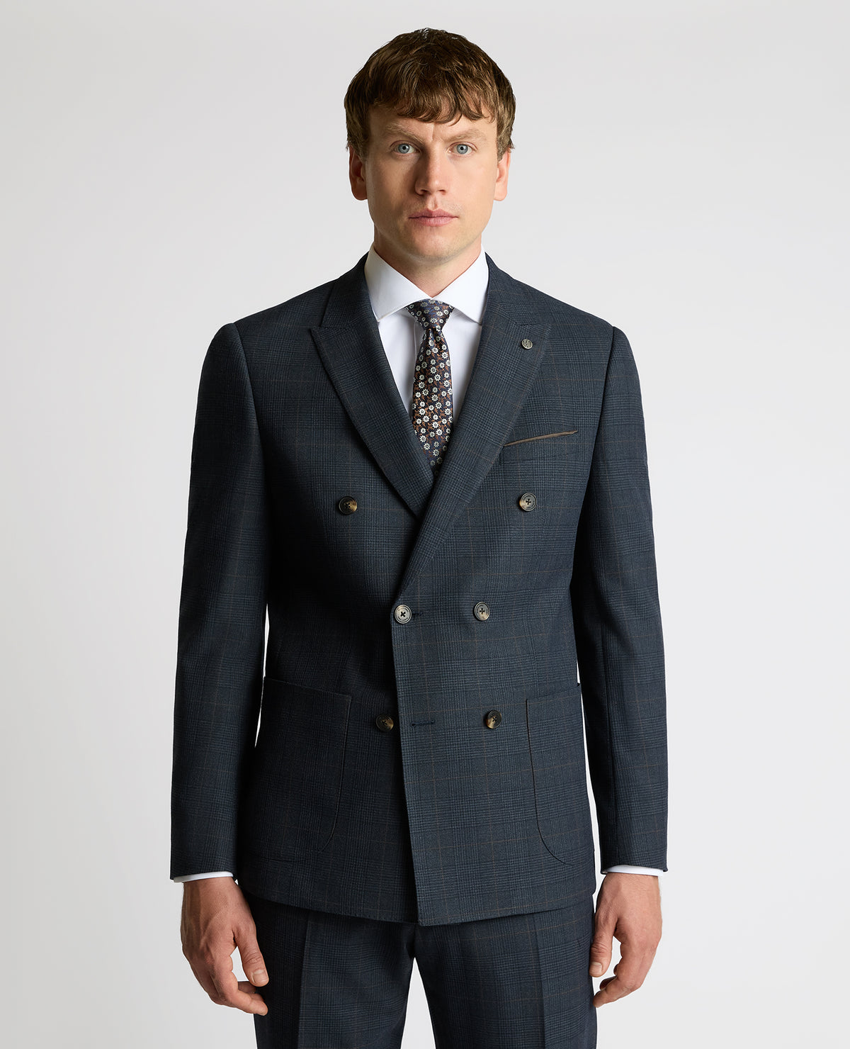 Man wearing a navy Slim Fit Double-Breasted Stretch Jacket