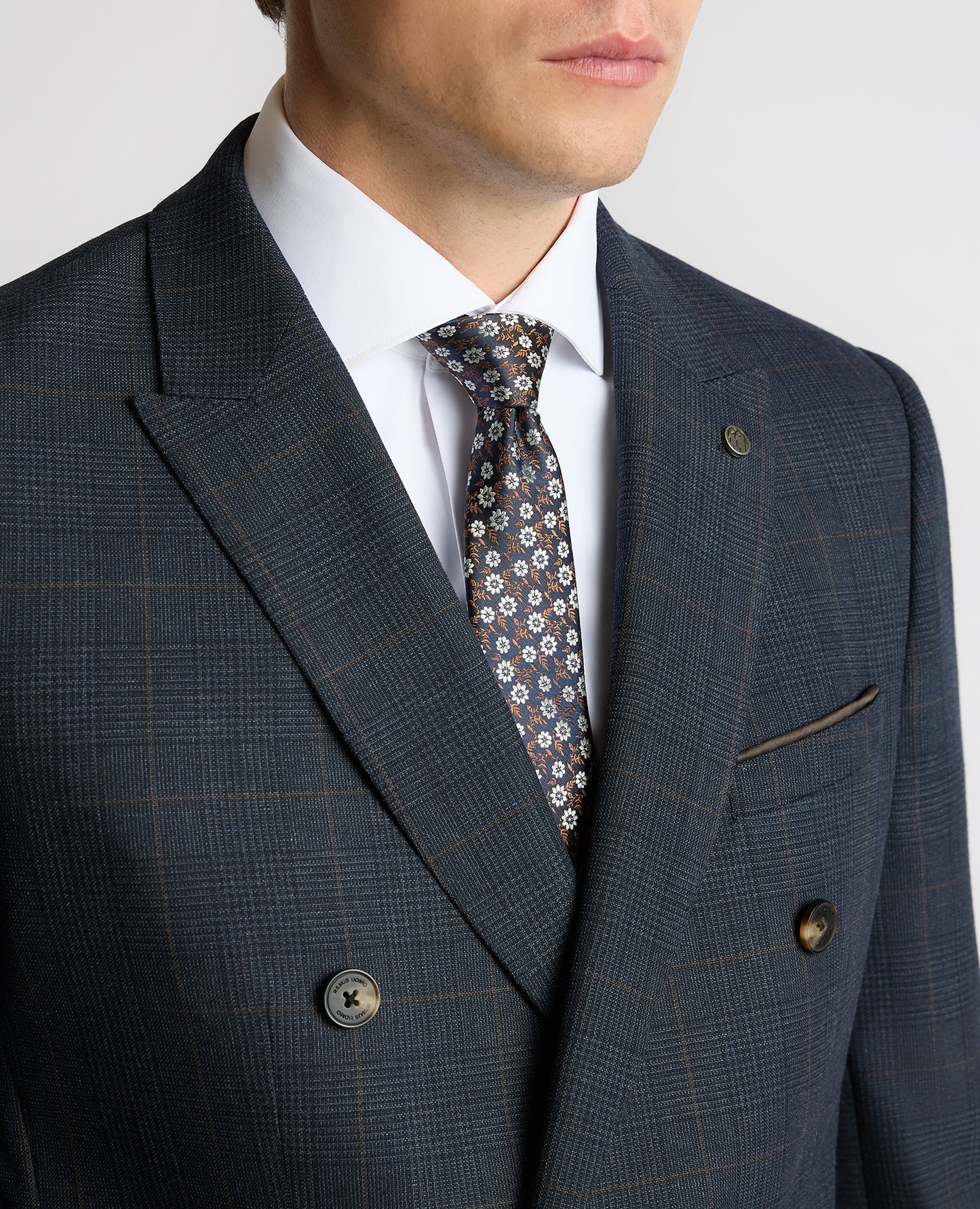 Man wearing a navy Slim Fit Double-Breasted Stretch Jacket