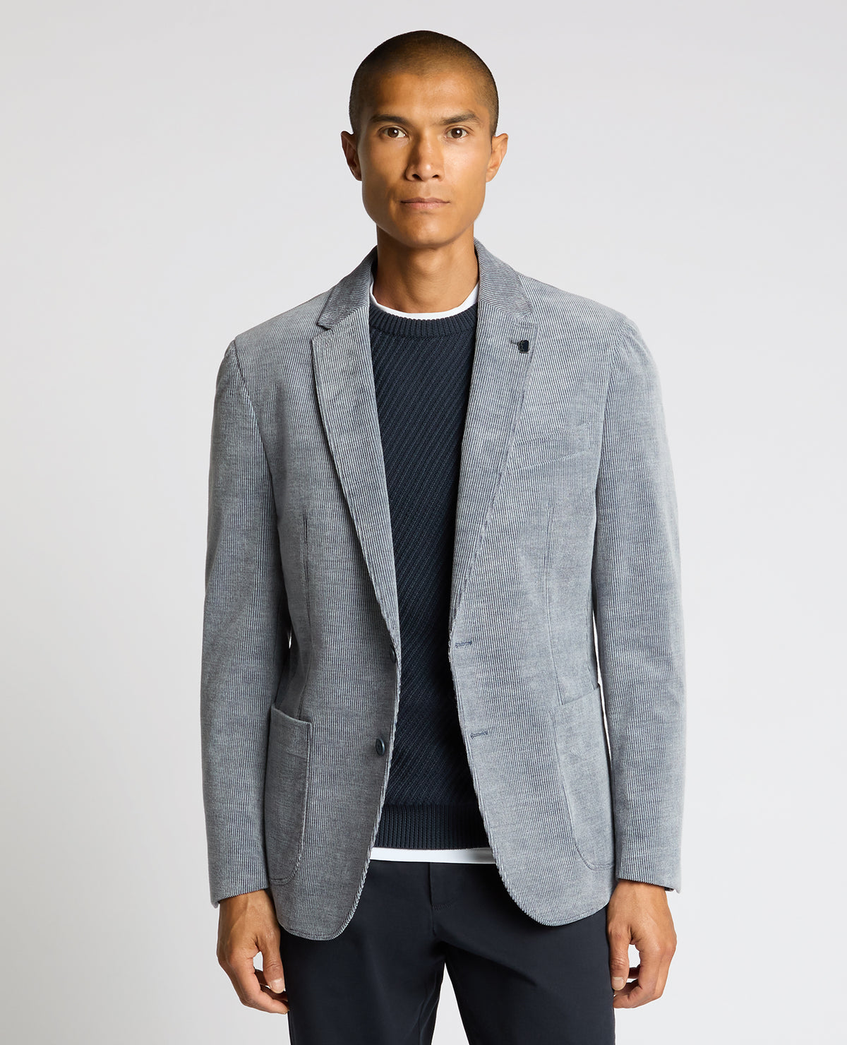 Man wearing a blue Slim Fit Cotton Stretch Alba Jacket