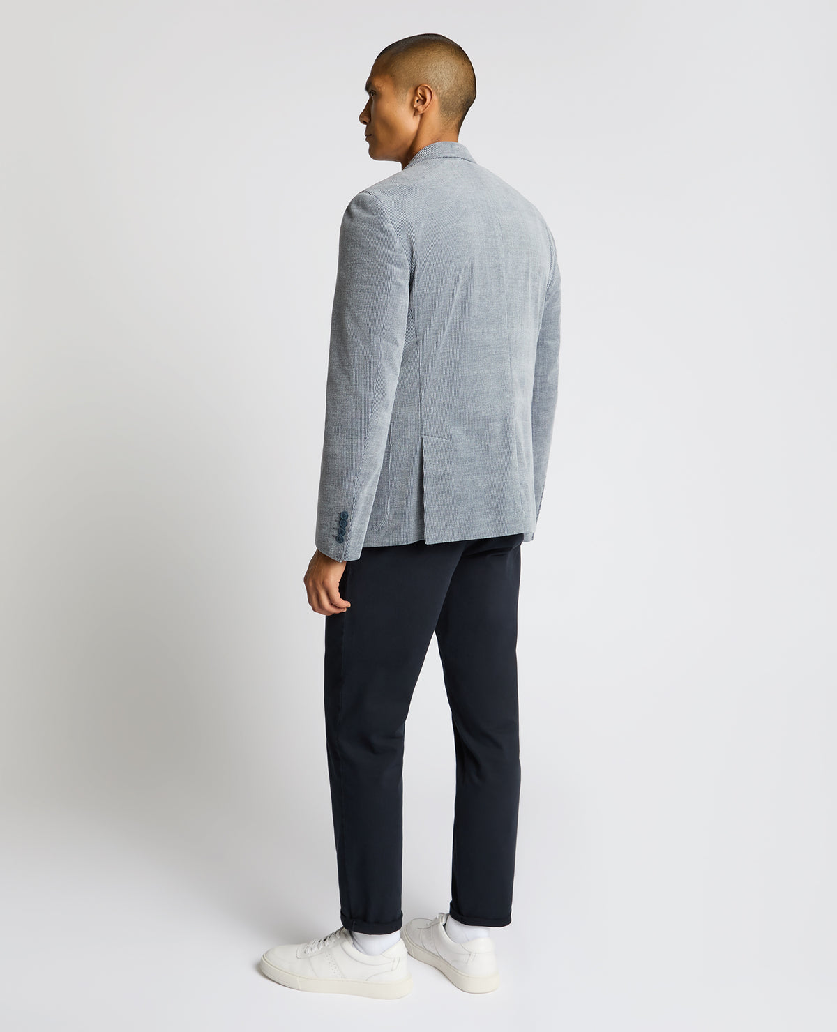 Man wearing a blue Slim Fit Cotton Stretch Alba Jacket