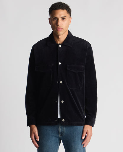 Man wearing a navy Tapered Fit Corduroy Overshirt
