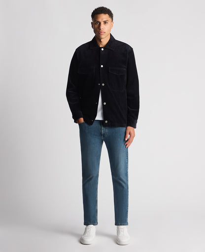 Man wearing a navy Tapered Fit Corduroy Overshirt