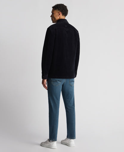 Man wearing a navy Tapered Fit Corduroy Overshirt