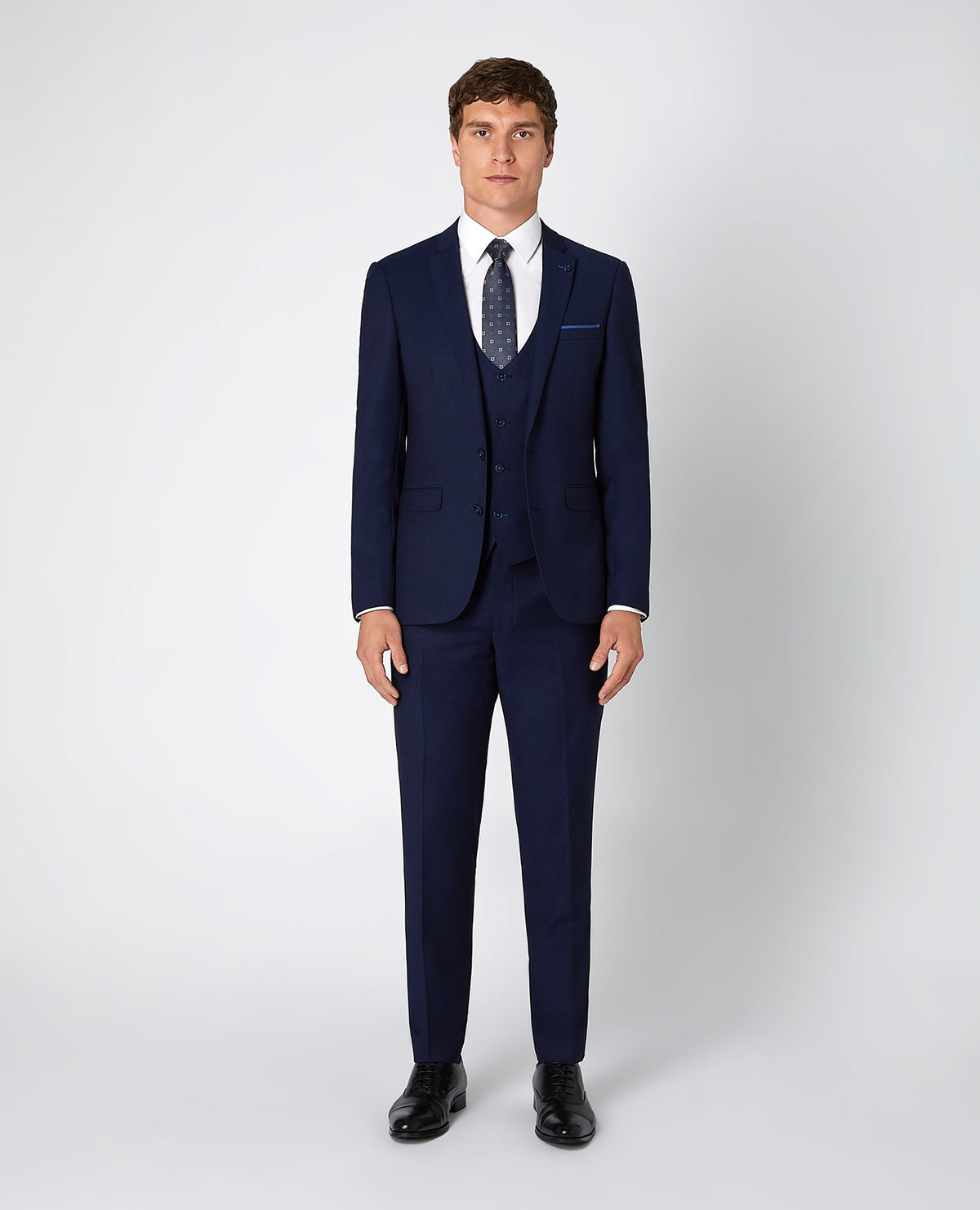Man wearing a blue X-Slim Fit Stretch 3 Piece Suit