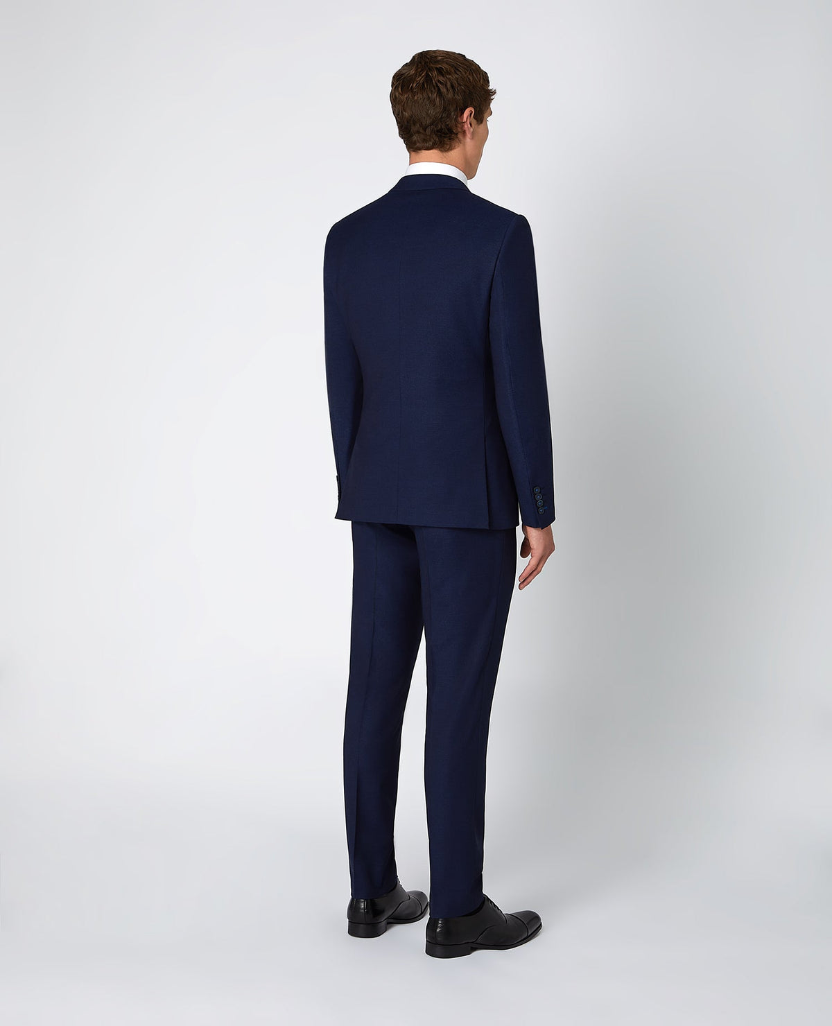 Man wearing a blue X-Slim Fit Stretch 3 Piece Suit