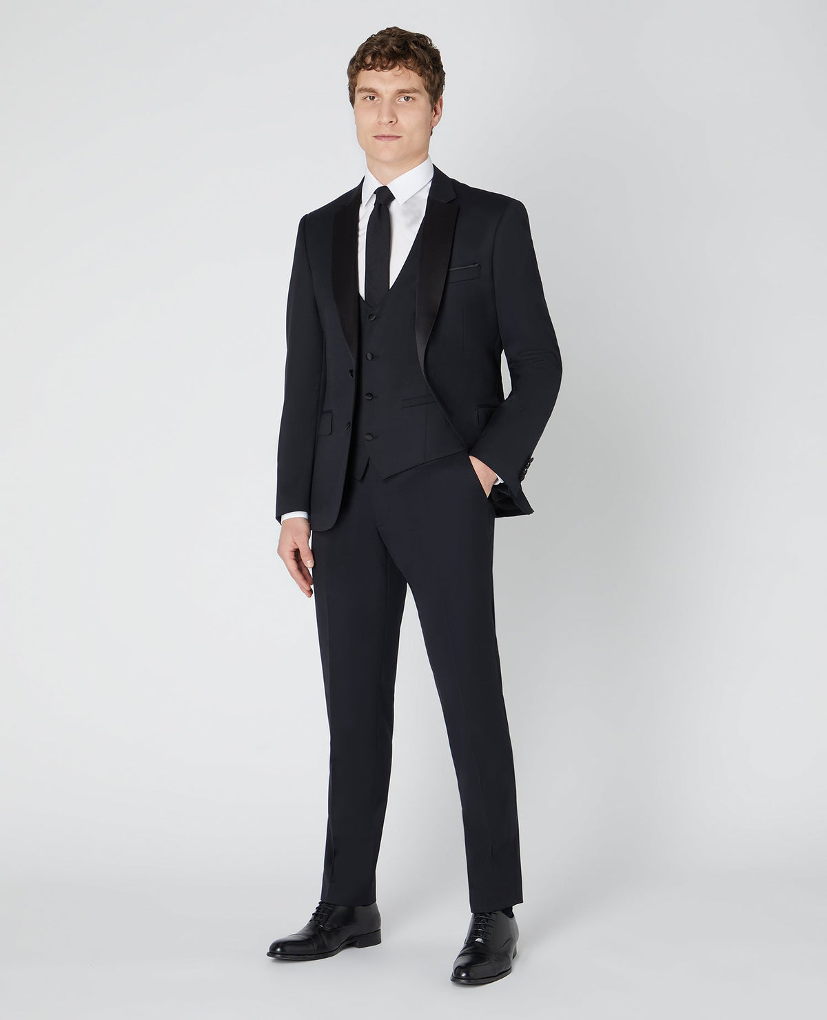 Man wearing a black Tapered Wool-Rich Mix and Match Suit Jacket