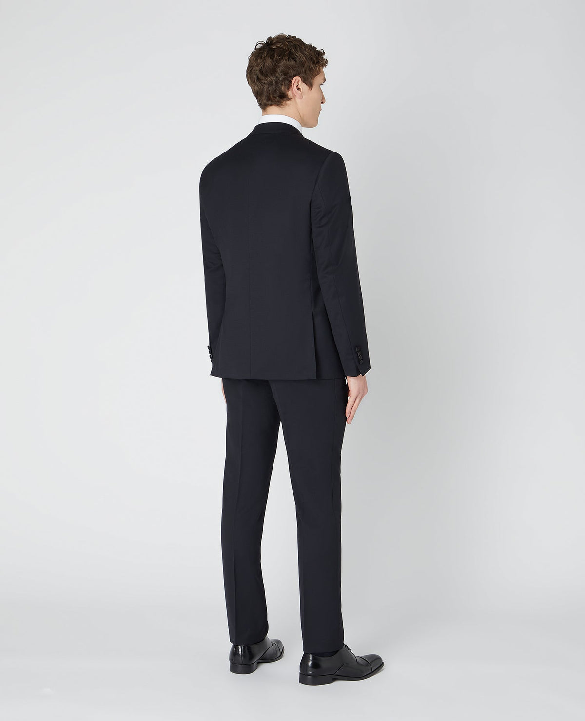 Man wearing a black Tapered Wool-Rich Mix and Match Suit Jacket