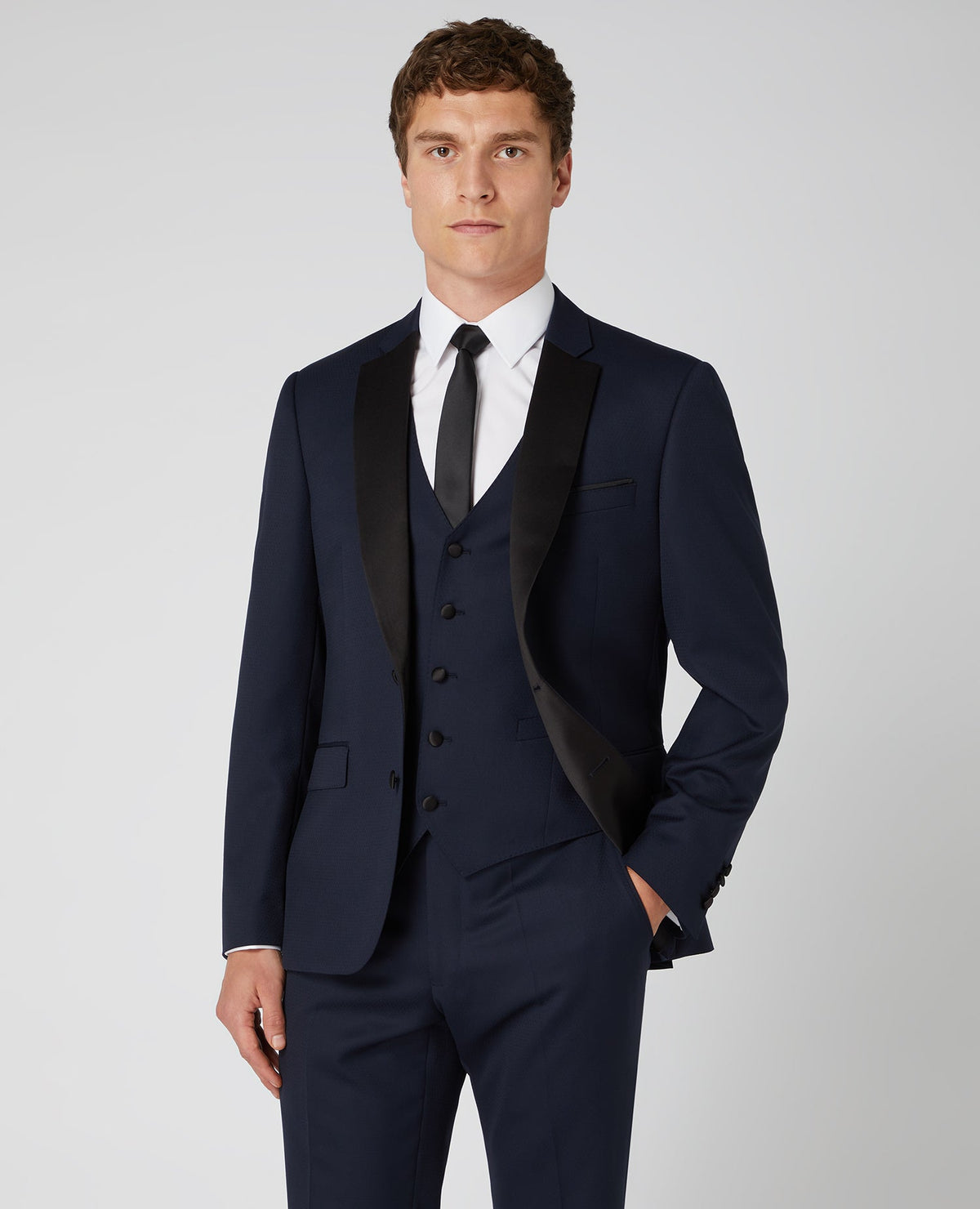 Man wearing a navy Tapered Wool-Rich Mix and Match Suit Jacket