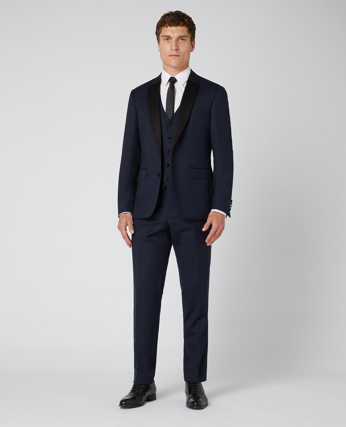 Man wearing a navy Tapered Wool-Rich Mix and Match Suit Jacket