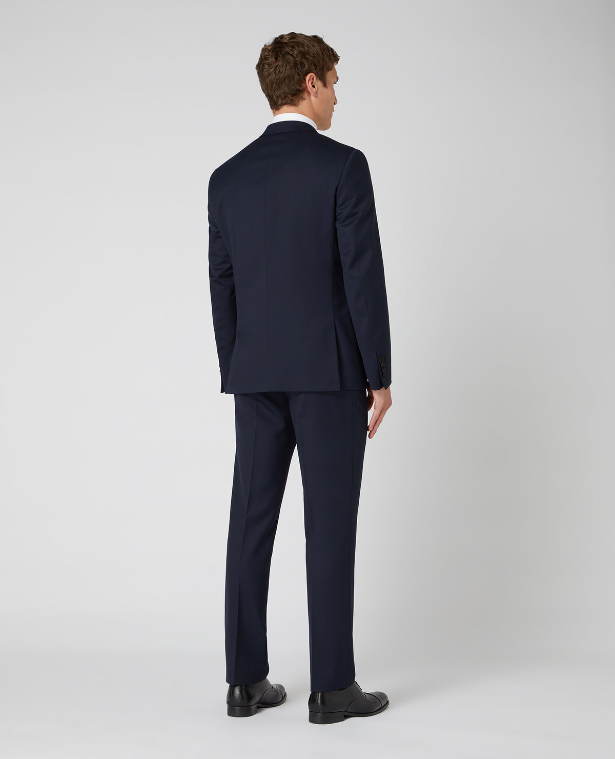 Man wearing a navy Tapered Wool-Rich Mix and Match Suit