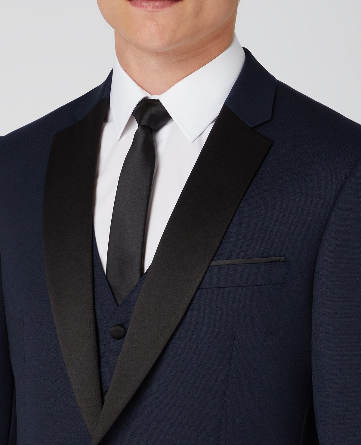 Man wearing a navy Tapered Wool-Rich Mix and Match Suit Jacket