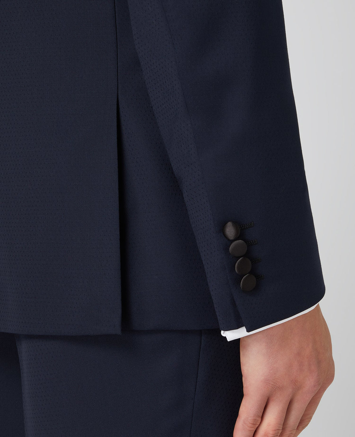 Man wearing a navy Tapered Wool-Rich Mix and Match Suit Jacket