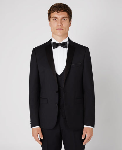 Man wearing a black Slim Fit Wool-Rich Mix and Match Dinner Suit
