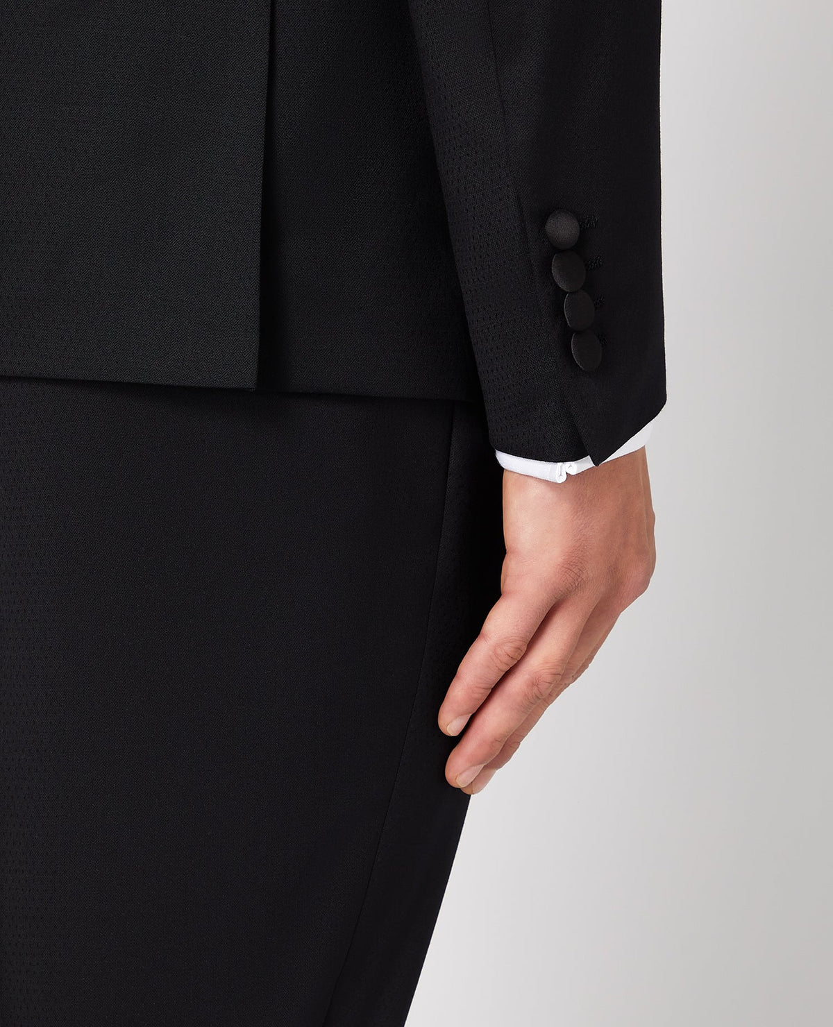 Man wearing a black Slim Fit Wool-Rich Mix and Match Dinner Suit