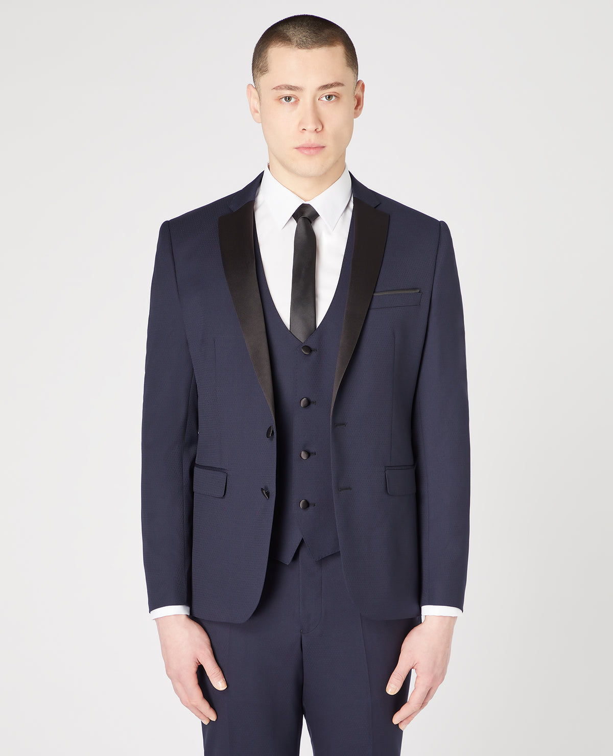Man wearing a navy Slim Fit Wool-Rich Mix and Match Dinner Suit Jacket