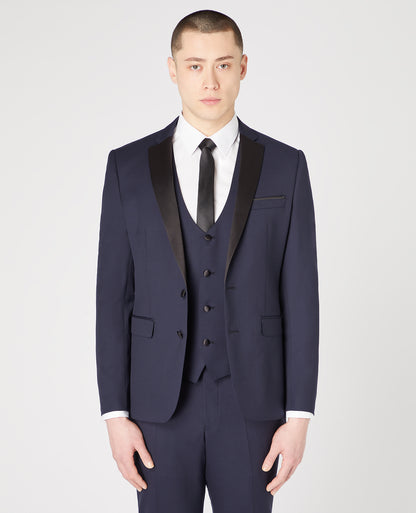 Man wearing a navy Slim Fit Wool-Rich Mix and Match Dinner Suit Jacket