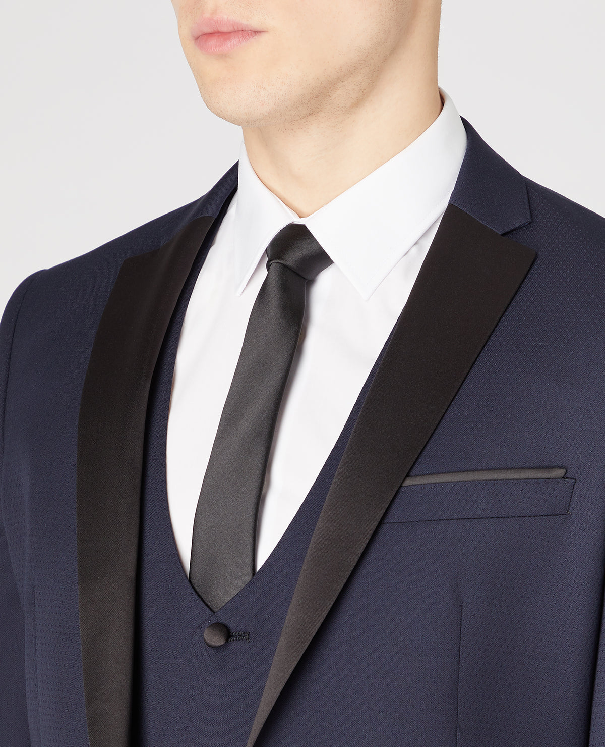 Man wearing a navy Slim Fit Wool-Rich Mix and Match Dinner Suit Jacket