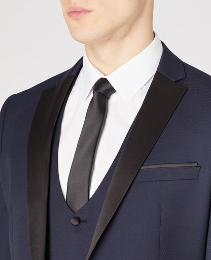Man wearing a navy Slim Fit Wool-Rich Mix and Match Dinner Suit Jacket