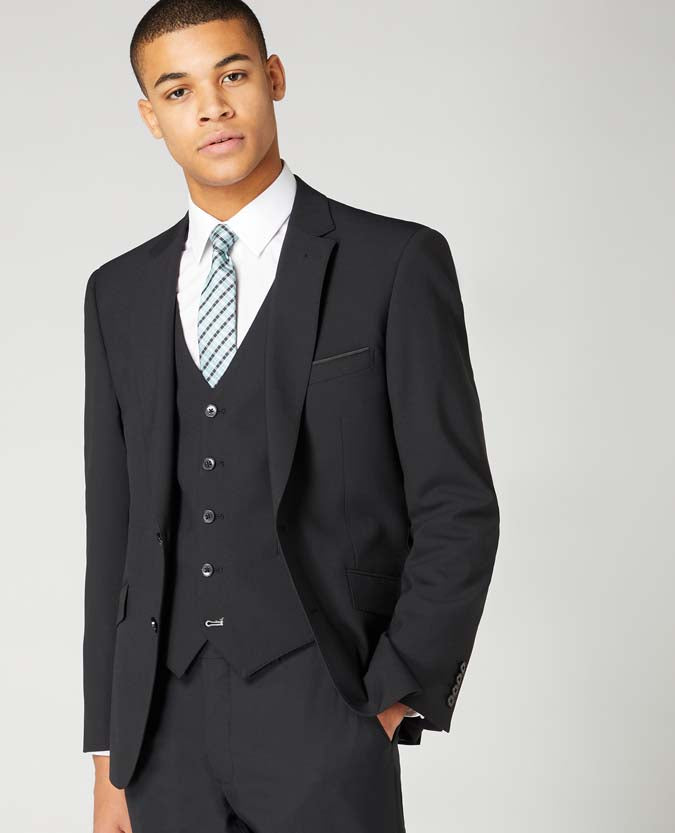 Man wearing a black Tapered Fit Wool-Blend Stretch Mix and Match Suit