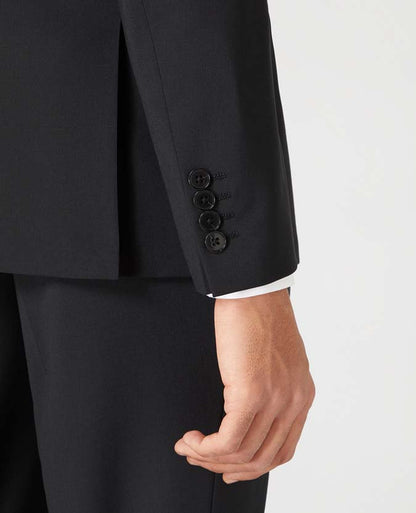 Man wearing a black Tapered Fit Wool-Blend Stretch Mix and Match Suit