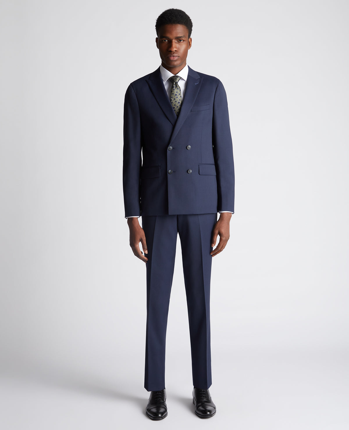 Man wearing a navy Slim Fit Wool-Rich Mix and Match Suit