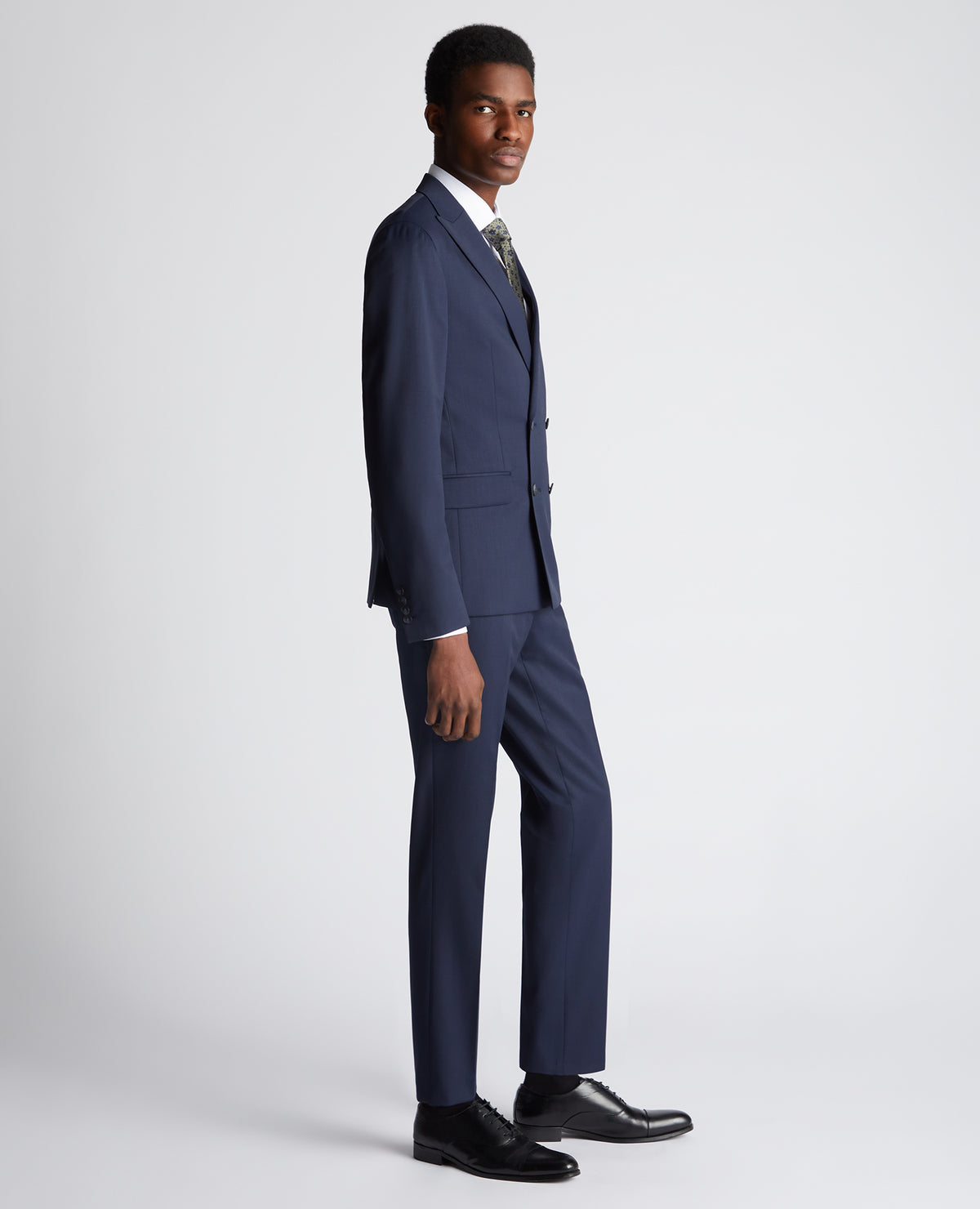 Man wearing a navy Slim Fit Wool-Rich Mix and Match Suit
