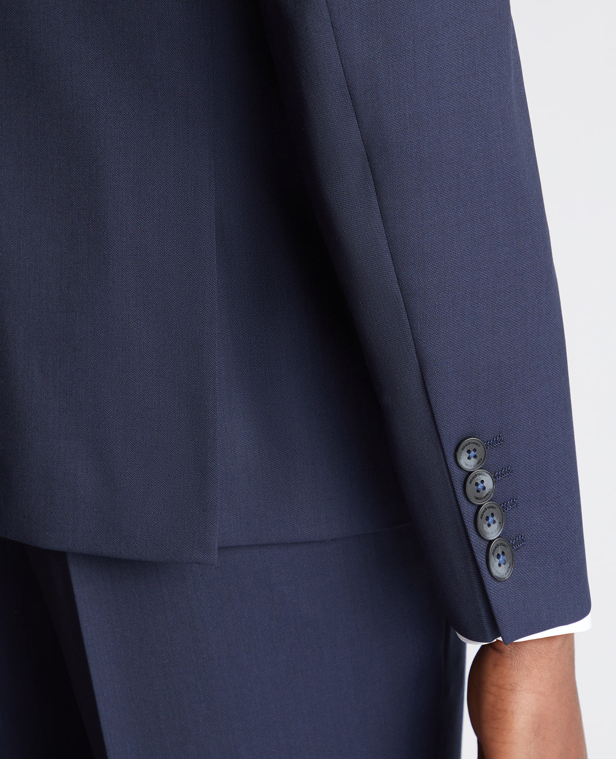 Man wearing a navy Slim Fit Wool-Rich Mix and Match Suit