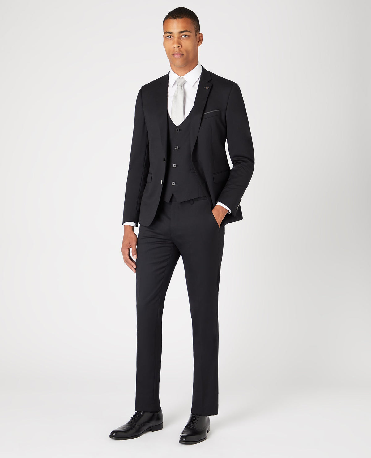 Man wearing a black Slim Fit Wool-Rich Mix and Match Suit Jacket