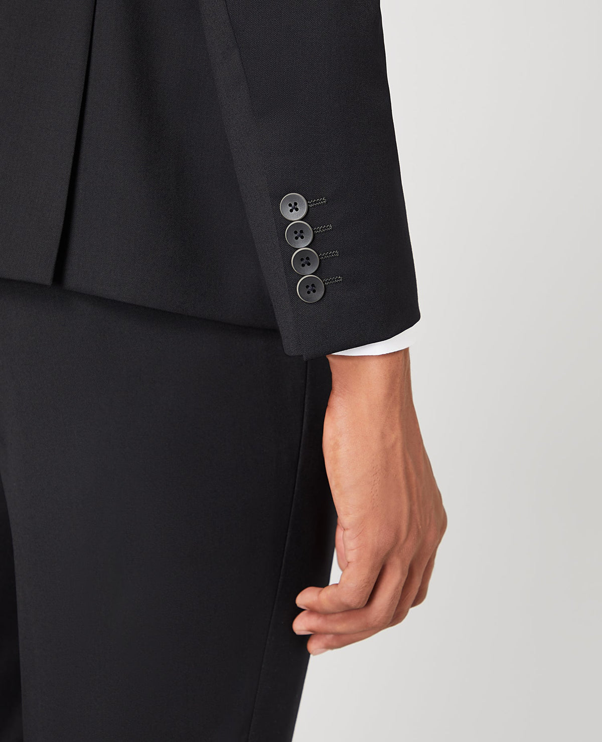 Man wearing a black Slim Fit Wool-Rich Mix and Match Suit Jacket