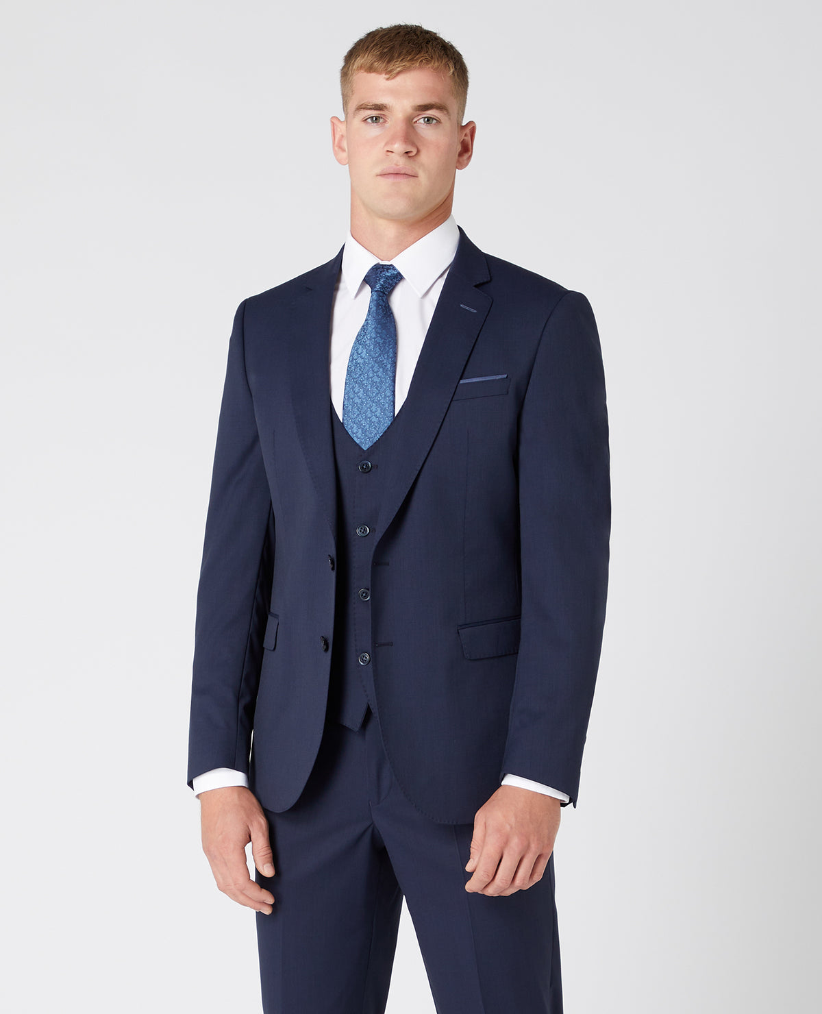 Man wearing a navy Slim Fit Wool-Rich Mix and Match Suit