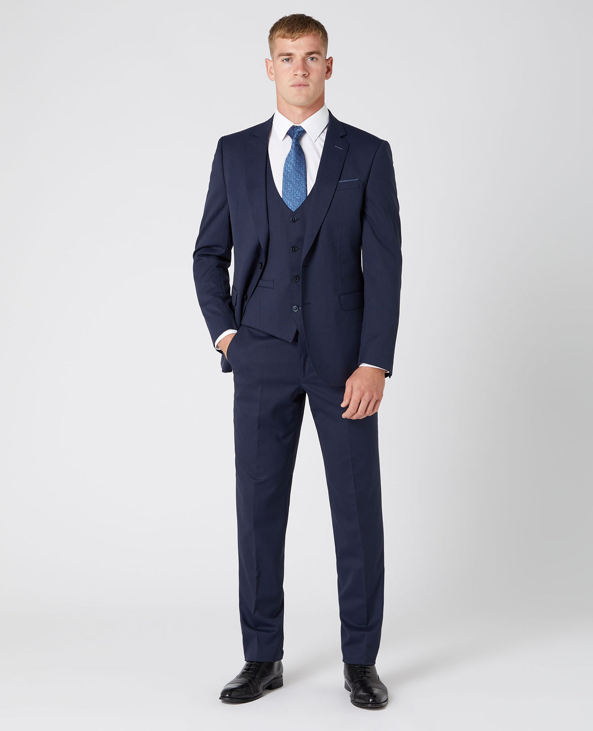Man wearing a navy Slim Fit Wool-Rich Mix and Match Suit