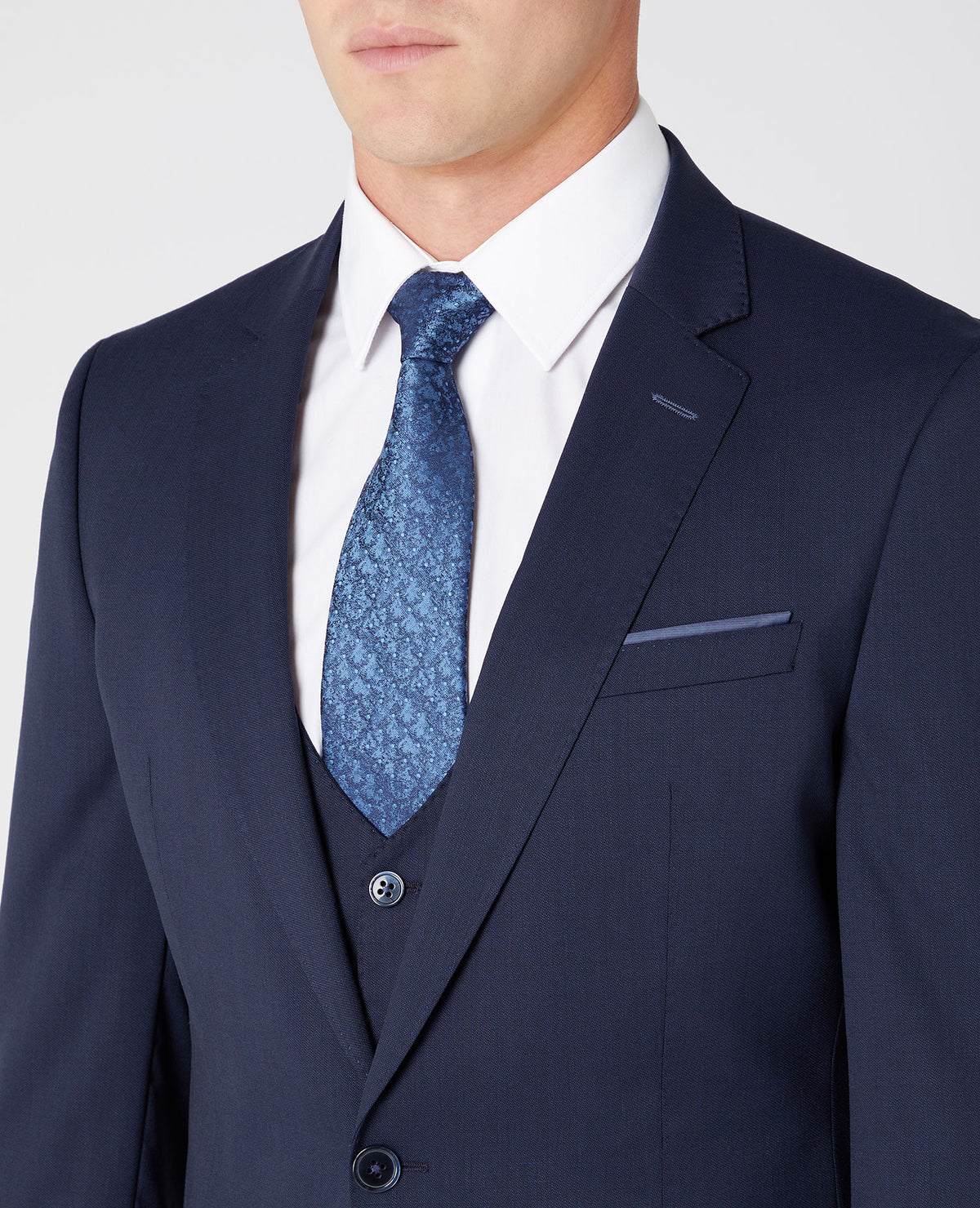 Man wearing a navy Slim Fit Wool-Rich Mix and Match Suit