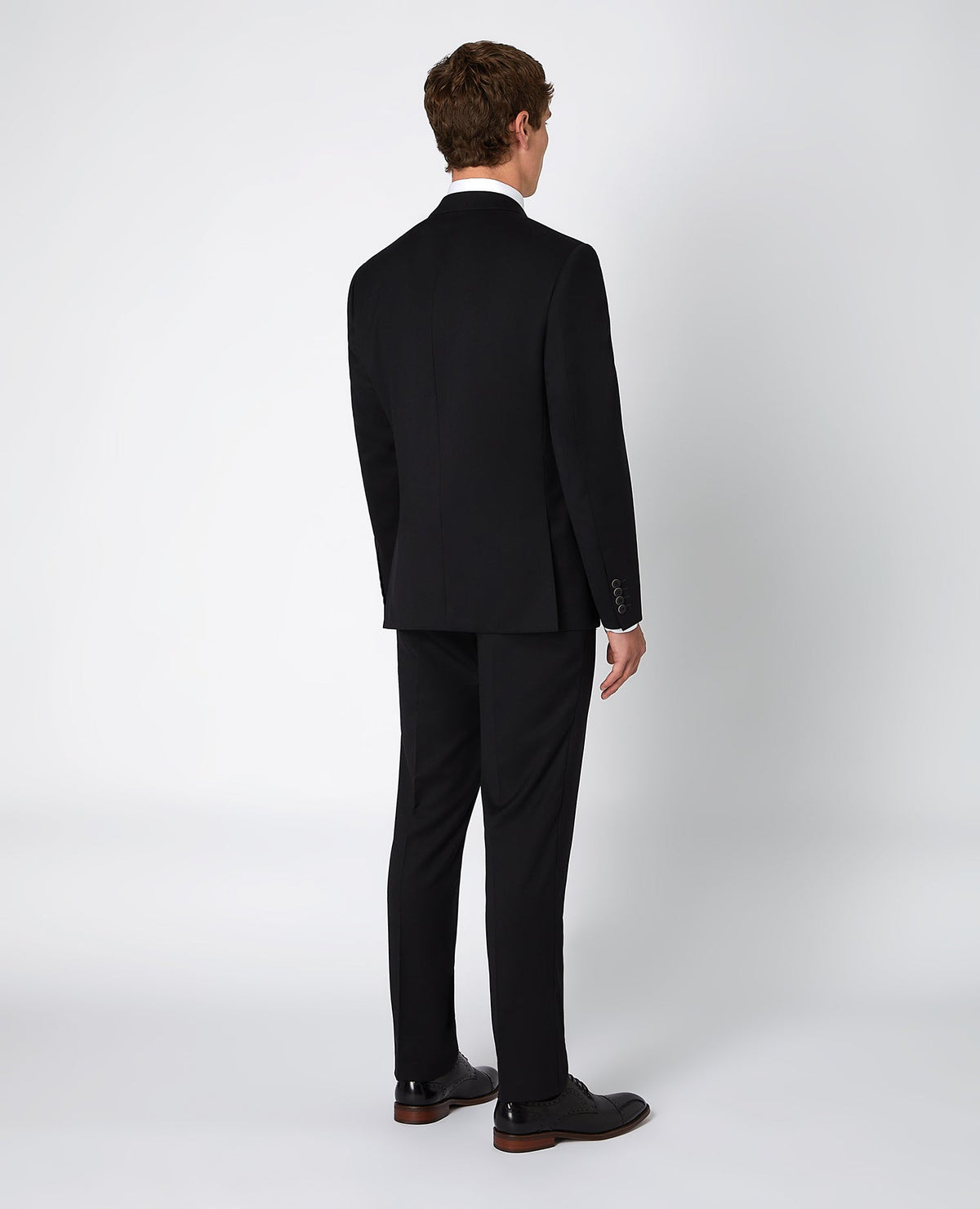 Man wearing a black Tapered Fit Wool-Blend Mix and Match Suit Jacket
