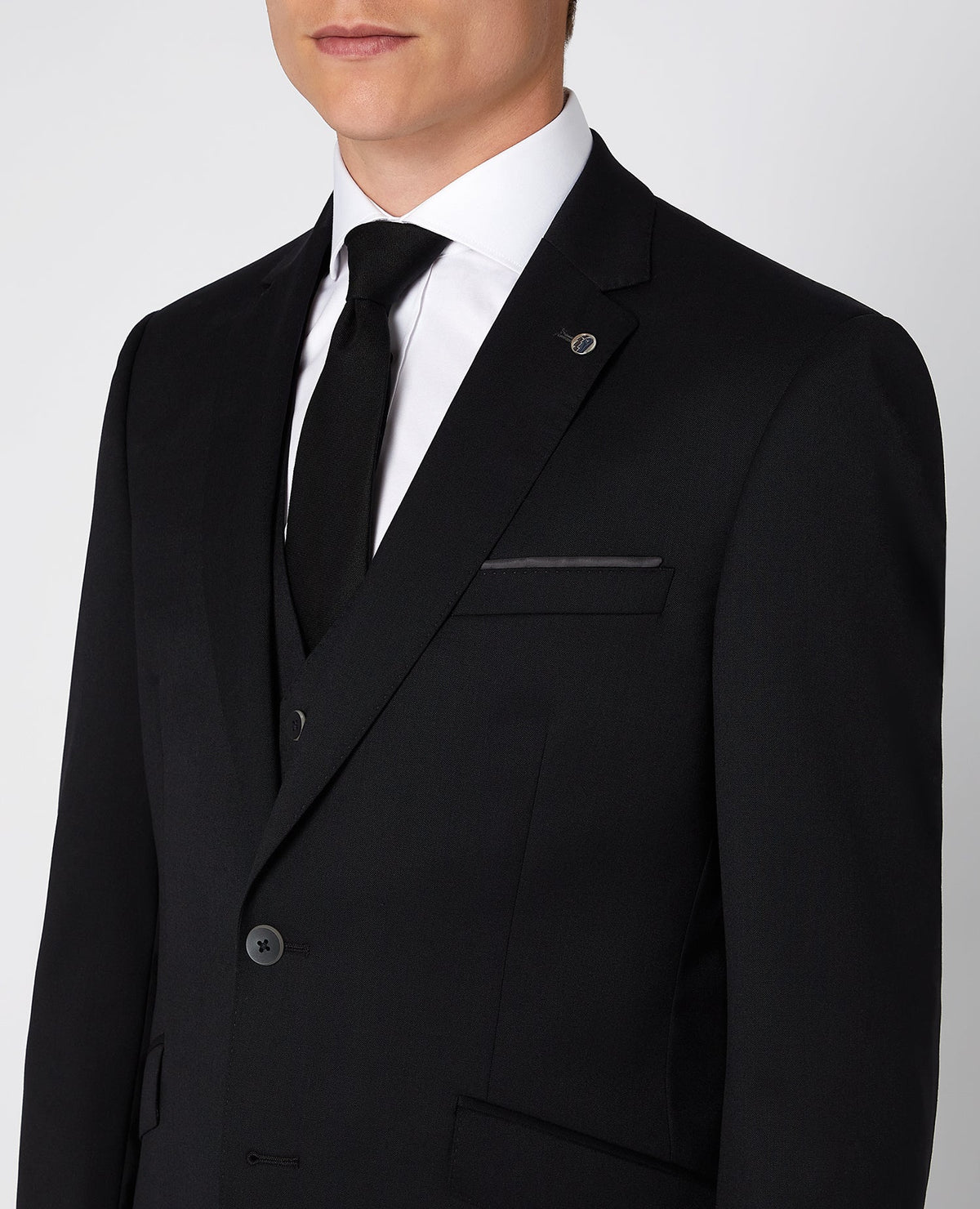 Man wearing a black Tapered Fit Wool-Blend Mix and Match Suit Jacket