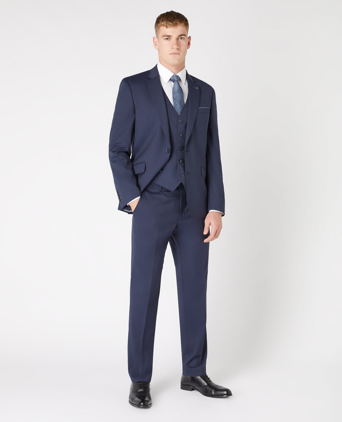 Man wearing a navy Tapered Fit Wool-Blend Mix and Match Suit