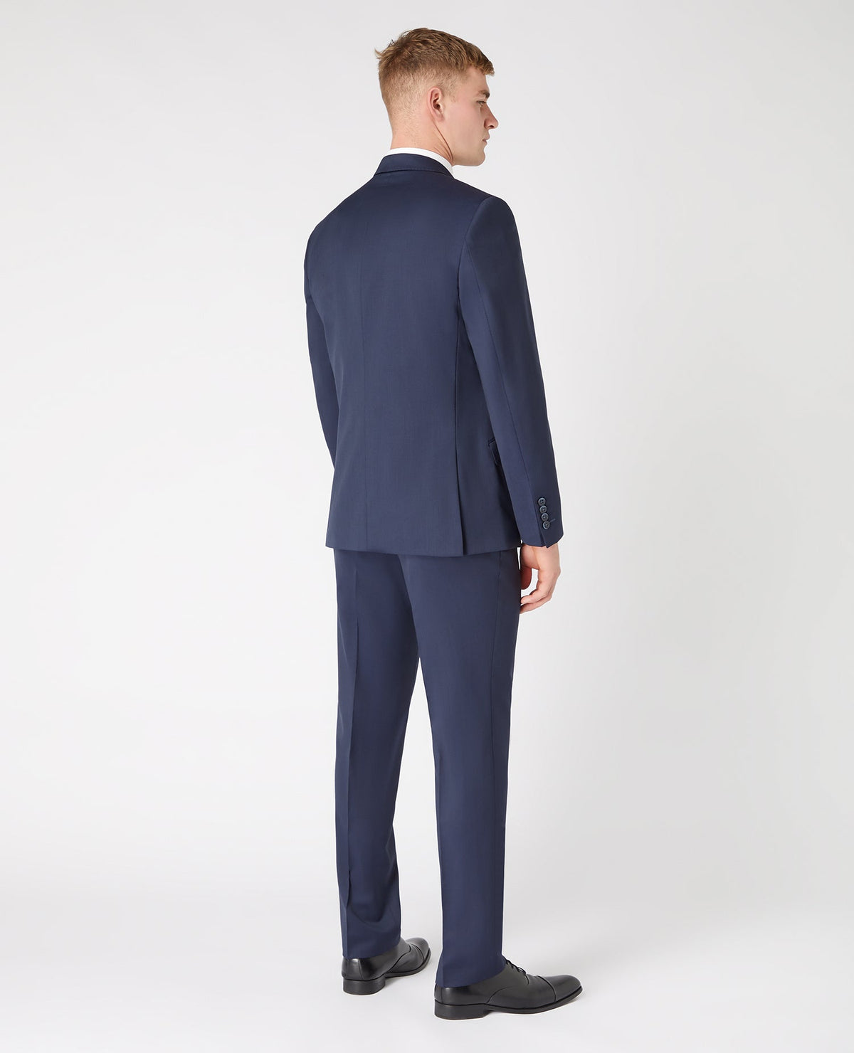 Man wearing a navy Tapered Fit Wool-Blend Mix and Match Suit