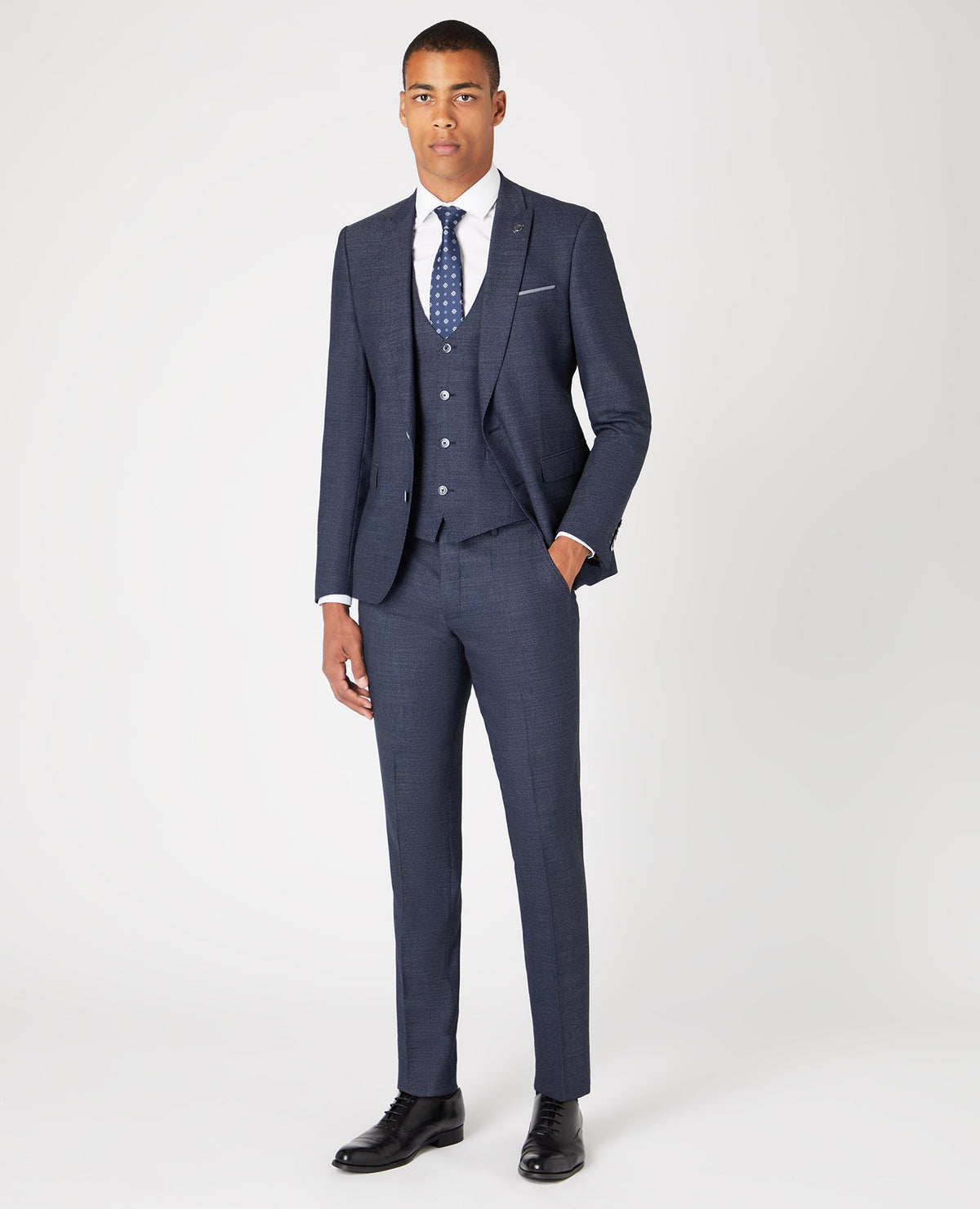Man wearing a blue Slim Fit Wool-Rich Mix and Match Suit