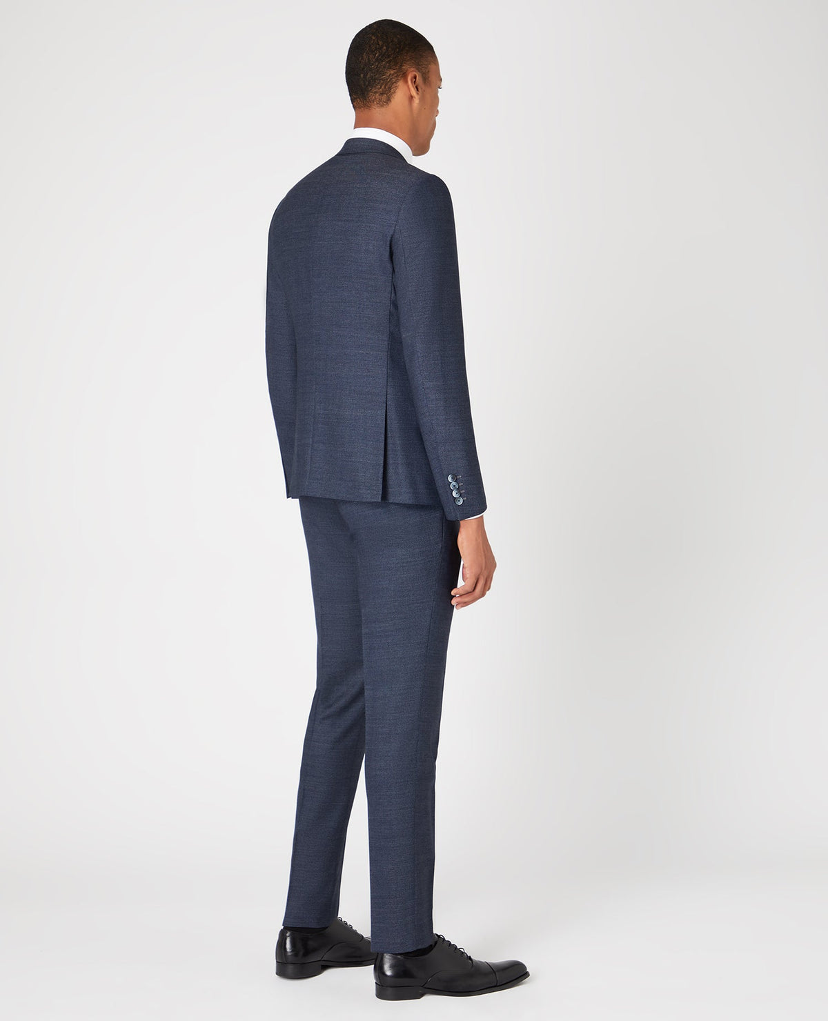 Man wearing a blue Slim Fit Wool-Rich Mix and Match Suit