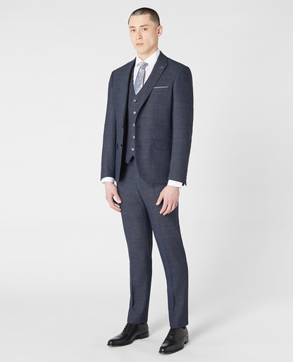 Man wearing a blue Tapered Fit Wool-Rich Stretch Mix and Match Suit Jacket