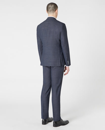 Man wearing a blue Tapered Fit Wool-Rich Stretch Mix and Match Suit Jacket