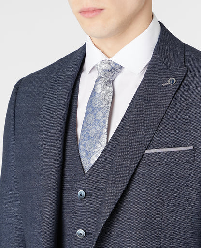 Man wearing a blue Tapered Fit Wool-Rich Stretch Mix and Match Suit Jacket