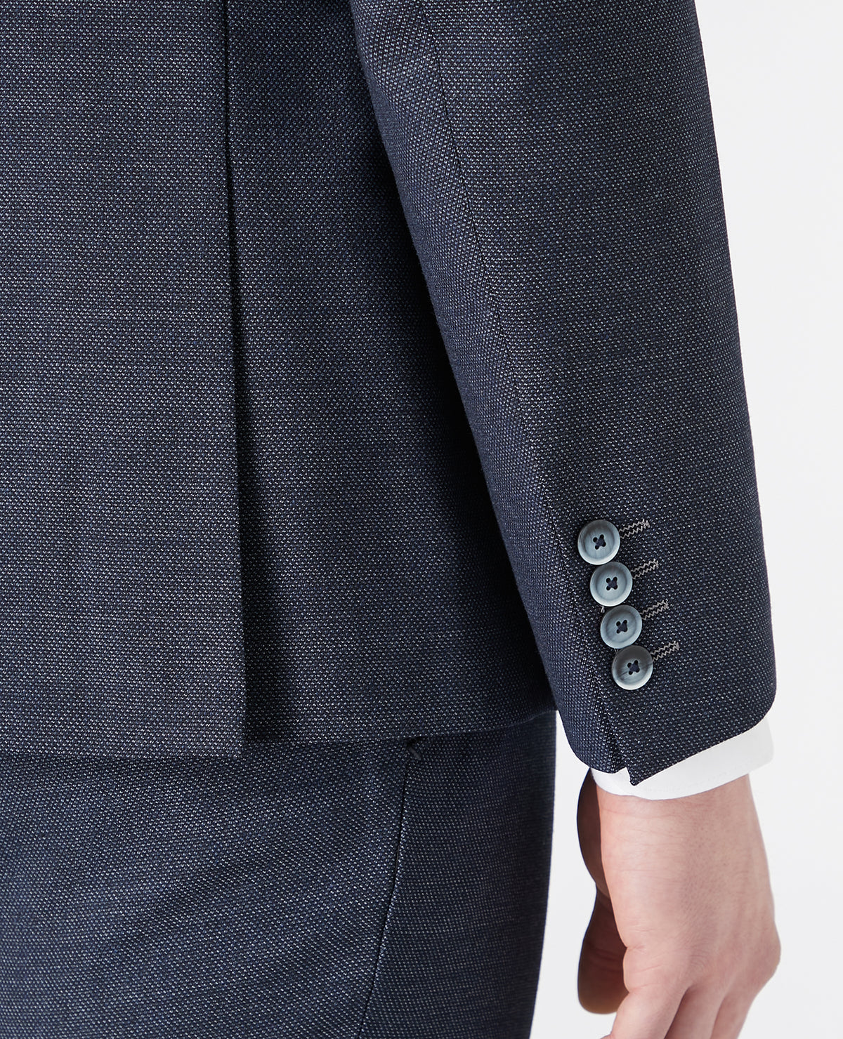 Man wearing a blue Tapered Fit Wool-Rich Stretch Mix and Match Suit Jacket