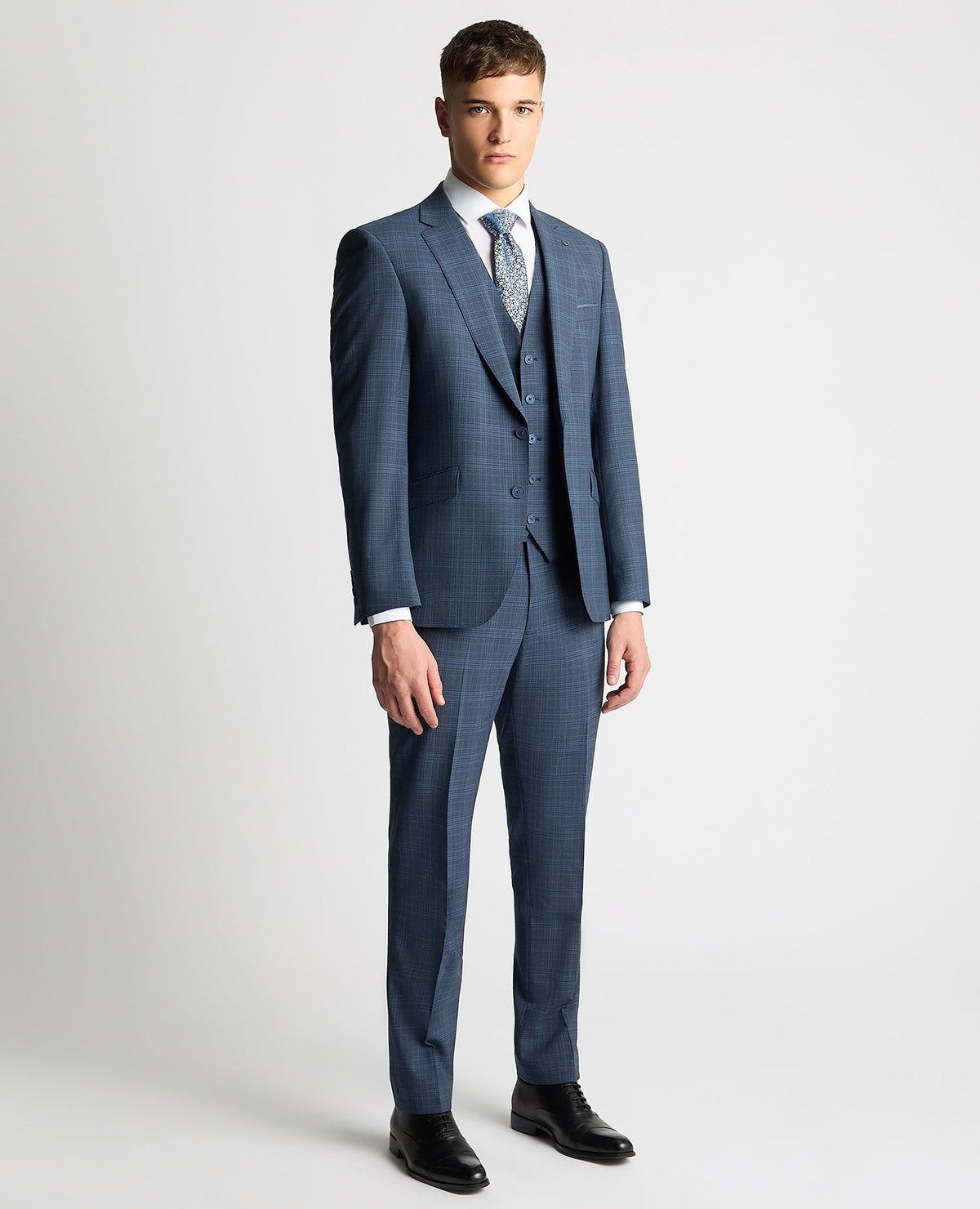Man wearing a blue Tapered Fit Checked Wool Blend Mix and Match Suit
