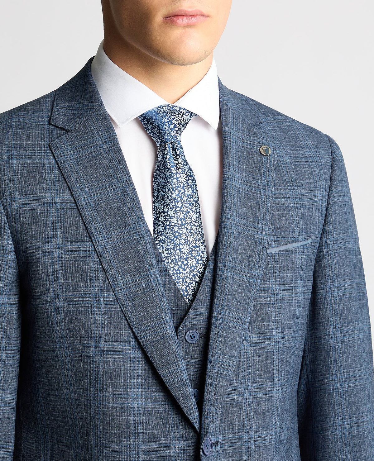 Man wearing a blue Tapered Fit Checked Wool Blend Mix and Match Suit