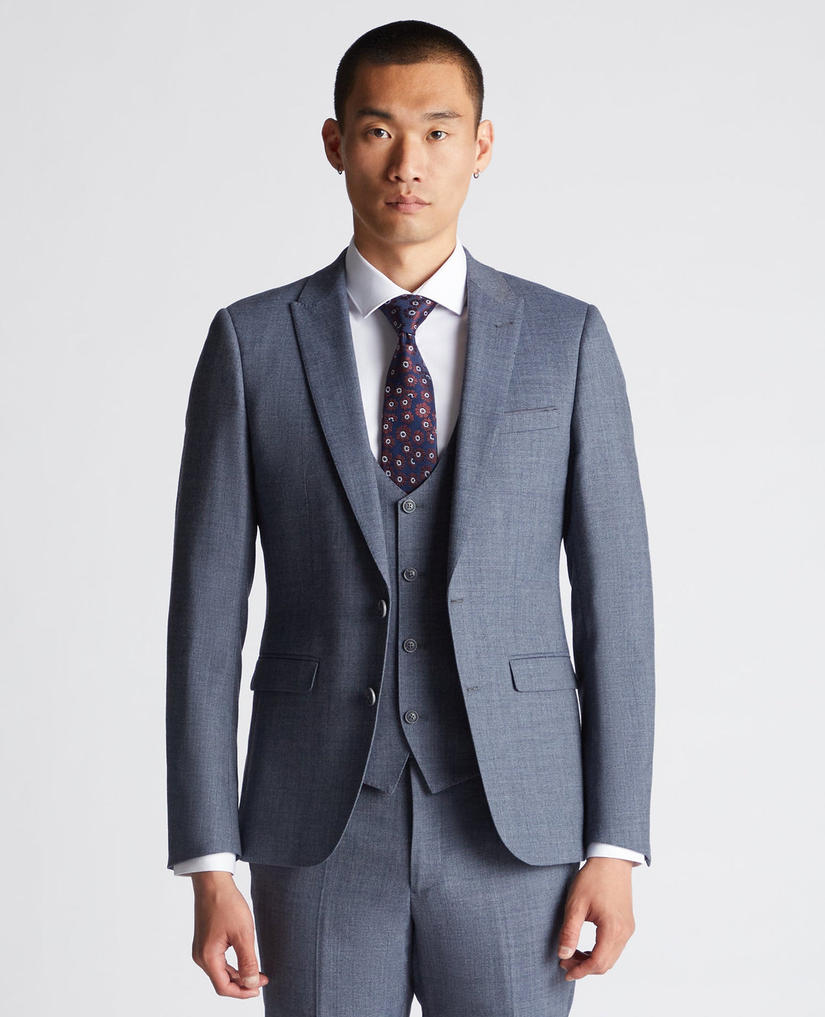 Man wearing a blue X-Slim Fit Wool Blend Mix And Match Suit Jacket