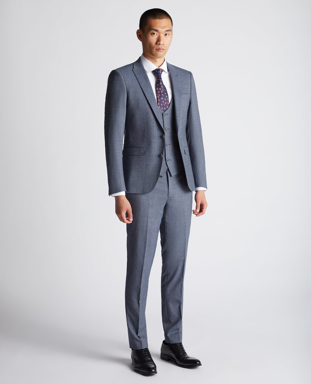 Man wearing a blue X-Slim Fit Wool Blend Mix And Match Suit Jacket